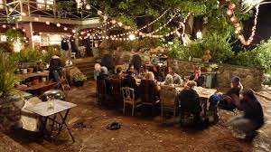 At Night The Patio Is The Perfect Spot For A Dining Party House Tour Zeek And Camille S House From Nbc S Parenthood Backyard Outdoor Backyard Inspiration