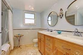 Freestanding bathroom cabinets at argos. Bright Bathroom In Blue Tones With Cabinets Shower And Toilet Decorated With Small Metal Table And Antique Light On The Wall Stock Photo Picture And Royalty Free Image Image 59956243