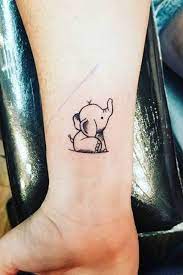 16 Adorable Tiny Elephant Tattoos That You Ll Never Forget Tiny Elephant Tattoo Elephant Tattoo Small Baby Tattoos