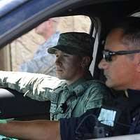 Maj. Woody Groton, Lt. Jeffrey Ladieu, and other members