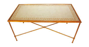 A Contemporary Cocktail Table With Gilded Details The Table Has A Smoked Glass Table Top With A Greek Key Geometric Cocktail Tables Glass Top Table Greek Key