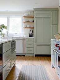 Beautiful Kitchen Features Sage Green Cabinets Paired With White Quartz Countertops Green Kitchen Island Sage Green Kitchen Kitchen Cabinet Design