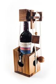 The wooden wine puzzler's rope can be adjusted to accommodate different bottle heights and makes an ideal beverage decanter for other bottles types elevate the traditional gesture of handing over a bottle of wine to a fun and exciting level by locking it in this clever wooden puzzle brain teaser for a. Don T Break It Puzzle Wine Puzzle Kubiya Games