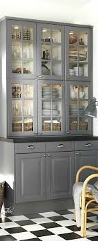 While the paneled wood gives the cabinetry a more traditional look, the interior design team behind bibby + brady went with handleless doors for a contemporary twist. Pin By Ann Mccright On Swedish Millionairess Diy Kitchen Cabinets Kitchen Design Grey Kitchens