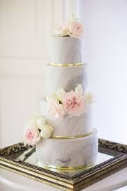On Trend Four Tier Marble Wedding Cake With Gold Details And Blush And Cream Flowers Www Weddi Wedding Cake Marble Elegant Wedding Cakes Tiered Wedding Cake