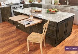 The Kraftmaid Pull Out Table Lets You Create More Counter Space Or More Floor Space Dependin Custom Kitchen Remodel Kitchen And Bath Showroom Kitchen Remodel