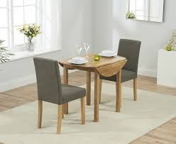 Our roundup of top expandable dining tables will effortlessly transition from a table for 6 to 12 when top 20 modern expandable dining tables. Promo Oak Round Drop Leaf Extdining Table With 2 Maiya Brown Browse Over 500 Stylish Products Go Furniture Co Uk