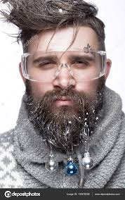 Funny bearded man in a New Years image with snow and decorations