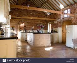 stone flagged floor and island unit in