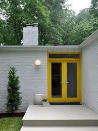 Which are of different shapes and here you would have light to dark. Doorways Entryways Modern Remodelista Yellow Front Doors Modern Front Door Front Door Design
