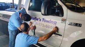 Use vinyl vehicle lettering to get your phone number, website, company logo or any contact information on the vehicle. Rafie S Towing Vinyl Lettering Installation Process Front Signs
