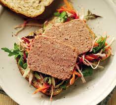 Lots of beef, mustard on the bread and a dill pickle on the side. Corned Beef And Beetroot Coleslaw Sandwich