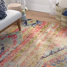 Try layering a faux cowhide rug over a jute base for an interesting visual that adds dimension to your room. Colorful Bohemian Rugs Wayfair