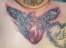 The chest and stomach area offers a large space for complex tattoos. Mechanical Heart And Torn Flesh Bu Justin Lewis Of Dermagraphink Tattoo Social Of Los Angeles Tattoo