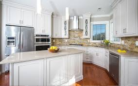 This travertine stone backsplash with natural hues adds warmth and contrasting texture to the kitchen. Ledger Stone Backsplash Nbizococho