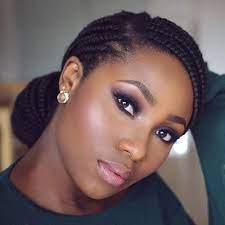 Half the box braids are tied up into a ponytail and half are left loose. Elegant Low Buns Natural Hair Styles Box Braids Hairstyles Hair Styles