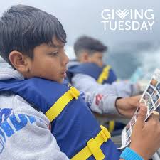 SCRUBBING THE SHORES: Atisa Britton works with her children Beau and Allera  and friend Casey Falvey to pick up debris