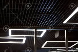 Modern Office Lighting Thin Lamps In Office Dark Ceiling Led Stock Photo Picture And Royalty Free Image Image 132679955