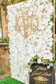 Flower Wall With Monogram Photo Booth In 2020 Flower Wall Wedding Wedding Reception Decorations Traditional Wedding Guest Book