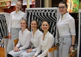 A woman who entertains customers, especially men, at a nightclub 3. Exhibition Hostesses Catering Stand Party Exhibition Stand Concepts Avec Plaisir Expo Services Messe Fullservice