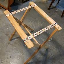 They can be stored in a closet or corner until you need them. Antique Frame Turns A Folding Tray Table Stand Into A Unique Table