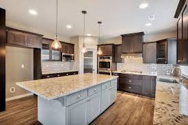 This Chic Kitchen Features Espresso Stained Cabinets And Gray Island Sw7017 Dorian Gr Buy Kitchen Cabinets Kitchen Cabinets Upgrade Kitchen Cabinets Pictures