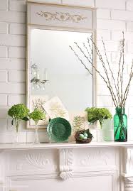 Along with the flowers, berries, and lush green leaves are aesthetically placed to create a visually stunning look that promises to mesmerize. Style A Spring Green Mantel