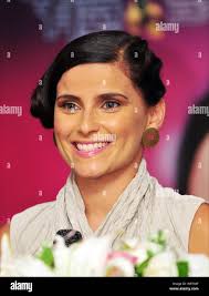 Canadian singer Nelly Kim Furtado smiles during a press conference for her  upcoming concert in Taipei, Taiwan, 10 August 2012 Stock Photo