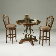 The two chairs and table base are made from solid eucalyptus wood with a warm brown finish. Indoor Bistro Table Chairs Ideas On Foter
