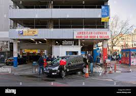 American Style Hand Car Wash And Vacuum Outside A Multi-storey Car Park In Great Eastern Street In The East End Of London Stock Photo - Alamy