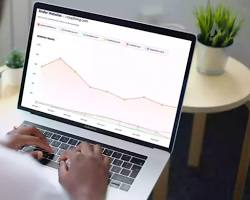 person analyzing competitor websites resmi