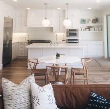 wishbone chairs and eames white table
