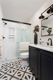 Dark color wooden floor and white color have a nice contrast. 10 Stylish Small Bathrooms With Walk In Showers