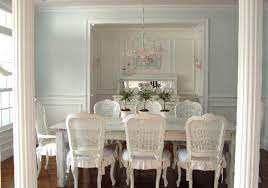 A vintage meets shabby chic dining room with an arrangement of mirrors, a wooden table and mismatching black chairs. 15 Pretty And Charming Shabby Chic Dining Rooms Home Design Lover