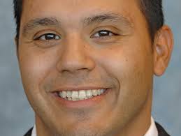 Robert Rodriguez coaches Vikings in playoff