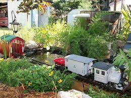 Electric Trains In The Garden Garden Railroad Garden Trains Garden Railway