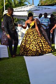 Is a large tube or length of fabric, often wrapped around the waist, worn in southeast asia, southern asia, western asia, northern africa, east africa, west africa and on many pacific islands. Zambian Kitchen Party African Traditional Dresses African Wedding Attire African Bride