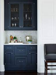 We want to paint our light oak kitchen cabinets white. Sw Indigo Batik Cabinet Color Kitchen Remodel Kitchen Inspirations Blue Kitchen Cabinets