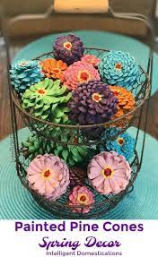 Start off by drilling a shallow hole in the bottom of each pinecone. How To Paint Pine Cones To Look Like Zinnia Flowers Spring Colors Painted Pine Cones Painted Pine Cones Spring Decor Diy Painted Pine Cones Pine Cone Crafts