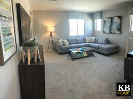 Great Little Area To Have The Grown Ups And Kids Hang Out And Play Some Family Game Night The Agreeable Gray Paint On The Walls Blends Kb Homes Home New Homes