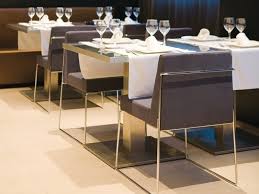 Japanese restaurant sushi bar sled base polished stainless steel leather tub chair with round wood grain laminate table. Chair With Sled Base In Polished Chrome Plated Iron Rod Idfdesign