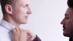 Gay man help his partner putting