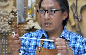 Erie woodcarver Fredy Huaman Malqui shares his skill with adult students