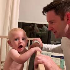 Baby baffled by dad's new look revealed during game of peek a boo