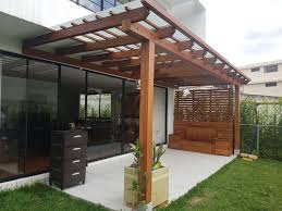 The heaters and the glisse and skate windbreak glass doors. Edificio Sabona Pergola Outdoor Structures Outdoor