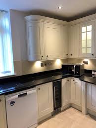 Howdens | inspirational kitchen design and ideas from the uk's number 1 trade kitchen supplier. Howdens Tewkesbury Antique White Wood Matt Shaker Inframe Pilaster Kitchen Black Granite Appliances