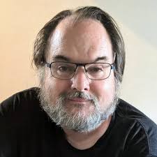 The woman believed to be the 'Babushka Lady,' wearing a headscarf, was seen  filming during the JFK assassination. Positioned ideally to record critical  moments, she never revealed herself, and her identity remains