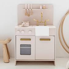 wooden toy kitchen in soft pink