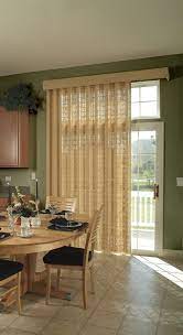Window drapes can completely cover the door or be pulled back to the sides with decorative tiebacks of matching fabric or decorative hardware. Dress A Sliding Glass Door With Blinds For Sliding Doors Patio Door Window Coverings Sliding Glass Door Window Sliding Glass Door Window Treatments