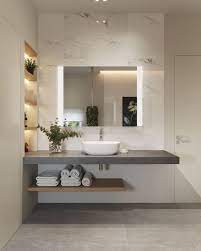 The sunny yellow and white color schemes are mimicked in the fixtures and linens of the room. 38 Most Popular Bathroom Design Ideas That Will Trend In 2019 Bathroomdecor Bathroomdesign Popular Bathroom Designs Bathroom Interior Design Bathroom Design